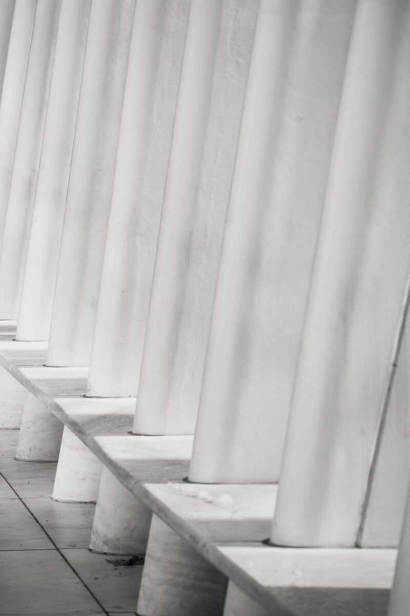 White ribs of exterior of modern terminal station located in New York City on sunny day